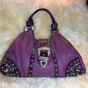 Plum shoulder bag worn in Las Vegas last year